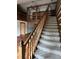 Grand staircase leading to an upper level, complemented by open concept design at 10770 W 650 S, Columbus, IN 47201