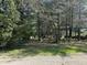 Expansive yard featuring mature trees and a mix of sunlight and shade at 10770 W 650 S, Columbus, IN 47201