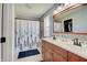 Bathroom featuring vanity with dual sinks, medicine cabinet, and shower/tub at 11124 Winterwood Dr, Indianapolis, IN 46235