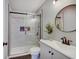 Bathroom featuring a glass shower door, gray vanity with sink, and modern finishes at 11124 Winterwood Dr, Indianapolis, IN 46235