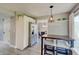 Eat-in kitchen with modern appliances next to dining room featuring extra storage at 11124 Winterwood Dr, Indianapolis, IN 46235