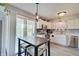 Bright eat-in kitchen features stainless steel appliances, white cabinets, and sliding glass door at 11124 Winterwood Dr, Indianapolis, IN 46235
