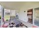 Relaxing screened porch featuring patio furniture and sliding glass door into the home at 11124 Winterwood Dr, Indianapolis, IN 46235