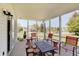 Charming screened-in porch with views of the landscaped front yard at 11124 Winterwood Dr, Indianapolis, IN 46235