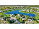 A scenic aerial view highlighting the home's proximity to a serene lake and landscaped surroundings at 11341 Abercairn Ct, Zionsville, IN 46077