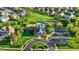 Stunning aerial view of a community clubhouse, pool, playground, basketball court, and meticulously landscaped green spaces at 11341 Abercairn Ct, Zionsville, IN 46077
