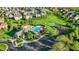 Beautiful aerial shot of a community pool, playground, and basketball court surrounded by lush greenery and well-maintained homes at 11341 Abercairn Ct, Zionsville, IN 46077