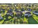 Aerial shot of homes surrounded by trees, showcasing spacious backyards and green landscape at 11341 Abercairn Ct, Zionsville, IN 46077