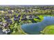 Scenic aerial view featuring a lake and beautiful landscaping in a residential neighborhood at 11341 Abercairn Ct, Zionsville, IN 46077