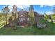 A beautiful backyard with lush green grass, mature trees, and a brick exterior at 11341 Abercairn Ct, Zionsville, IN 46077