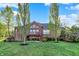 Beautiful backyard with a brick house, large deck, and patio, perfect for outdoor entertaining at 11341 Abercairn Ct, Zionsville, IN 46077