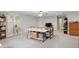 Spacious basement with carpet flooring, world map and folding bed/table at 11341 Abercairn Ct, Zionsville, IN 46077