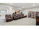 Large finished basement featuring a kitchenette, shelving, and comfortable recliner seating at 11341 Abercairn Ct, Zionsville, IN 46077