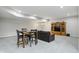 Finished basement with dining table, leather couch, and media center at 11341 Abercairn Ct, Zionsville, IN 46077