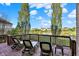 Scenic deck with lounge chairs overlooking a beautiful pond and neighborhood, perfect for relaxation at 11341 Abercairn Ct, Zionsville, IN 46077