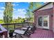 Relaxing deck featuring lounge chairs and a stunning view of the backyard and surrounding landscape at 11341 Abercairn Ct, Zionsville, IN 46077