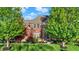 Two-story brick home with lush landscaping and mature trees at 11341 Abercairn Ct, Zionsville, IN 46077