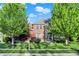 Beautiful brick home with stone accents, landscaped front yard, and mature trees at 11341 Abercairn Ct, Zionsville, IN 46077