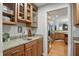 Kitchen features wood cabinets, granite countertops and stainless steel refrigerator at 11341 Abercairn Ct, Zionsville, IN 46077