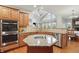 The kitchen has a center island with granite counters, stainless steel appliances, and an open-concept layout at 11341 Abercairn Ct, Zionsville, IN 46077