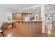 Spacious kitchen features wooden cabinets, stone accents and a breakfast bar for casual dining and entertaining at 11341 Abercairn Ct, Zionsville, IN 46077