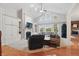 Inviting living room with high ceilings, a fireplace, and large windows offering natural light at 11341 Abercairn Ct, Zionsville, IN 46077