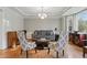Bright living room showcasing elegant details, hardwood floors, and stylish furniture at 11341 Abercairn Ct, Zionsville, IN 46077