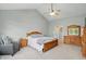 Main bedroom with ceiling fan, pale gray paint and carpet features traditional wood furniture at 11341 Abercairn Ct, Zionsville, IN 46077