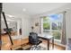 Bright office featuring a work desk, hardwood floors, and large window views at 11341 Abercairn Ct, Zionsville, IN 46077