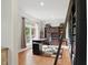 Home office with a large window, hardwood floors, and custom built-in bookcases with ladder at 11341 Abercairn Ct, Zionsville, IN 46077