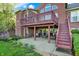 Covered patio with outdoor seating and stairs leading to an upper deck, creating an ideal relaxation space at 11341 Abercairn Ct, Zionsville, IN 46077