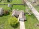 Aerial view of a charming home with a fenced backyard and well-manicured lawn in a peaceful residential area at 1170 Runningbrook Dr, Avon, IN 46123
