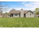 Expansive backyard featuring a well-maintained lawn, mature trees, and a charming wooden fence at 1170 Runningbrook Dr, Avon, IN 46123