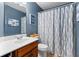 Cozy bathroom featuring a single sink vanity and tub with stylish curtain, creating a relaxing space at 1170 Runningbrook Dr, Avon, IN 46123