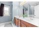 Well-lit bathroom with double vanity, large mirror, and modern fixtures at 1170 Runningbrook Dr, Avon, IN 46123