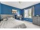 Comfortable bedroom with neutral walls, soft carpet, and a large window providing ample natural light at 1170 Runningbrook Dr, Avon, IN 46123