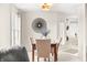 Bright dining area with seating for four, stylish lighting fixture, and neutral decor at 1170 Runningbrook Dr, Avon, IN 46123