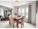 Charming dining area with a marble-top table, seating for four, and bright, natural light at 1170 Runningbrook Dr, Avon, IN 46123