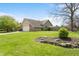 Well-maintained yard surrounding the exterior of the charming brick and siding house with an attached garage at 1170 Runningbrook Dr, Avon, IN 46123