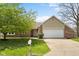 Charming single-story home with a brick facade, an attached two-car garage, and a well-manicured lawn at 1170 Runningbrook Dr, Avon, IN 46123