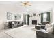 Bright living room with high ceilings, a cozy fireplace, and stylish, comfortable seating at 1170 Runningbrook Dr, Avon, IN 46123