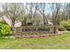Stone neighborhood entrance sign displaying 'Crystal Springs' with colorful flower bed at 1170 Runningbrook Dr, Avon, IN 46123