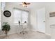 This bright home office space features natural light and a ceiling fan at 1170 Runningbrook Dr, Avon, IN 46123