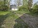 View of the spacious backyard and two car garage at 124 N Grant Ave, Indianapolis, IN 46201