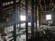 Upstairs area gutted and needing renovation with windows visible at 124 N Grant Ave, Indianapolis, IN 46201
