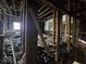 Upstairs area needing renovation with exposed framing and debris at 124 N Grant Ave, Indianapolis, IN 46201