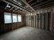 Basement framing shows studs and multiple windows allowing natural light, construction phase at 1509 Chatham Rdg Ct, Westfield, IN 46074