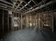 Unfinished basement with wooden framing, concrete floor, plumbing fixtures, and electrical boxes for future expansion at 1509 Chatham Rdg Ct, Westfield, IN 46074