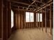 Bedroom with stud framing, and multiple windows allowing lots of natural light, construction phase at 1509 Chatham Rdg Ct, Westfield, IN 46074