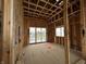 New construction bedroom framed with wood studs and beams featuring natural light at 1509 Chatham Rdg Ct, Westfield, IN 46074